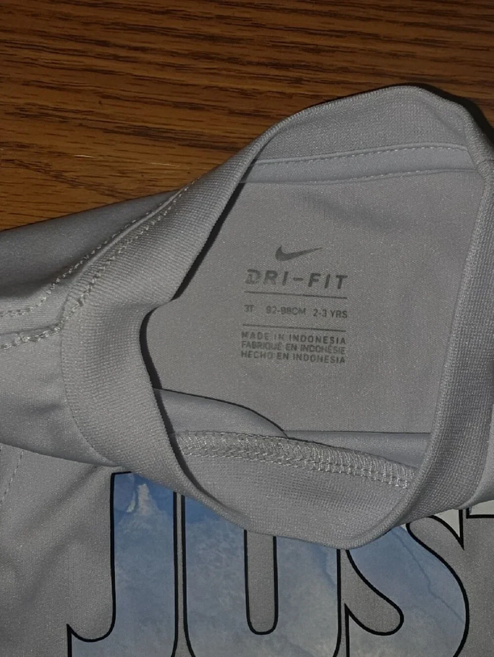 Nike White Tank Top with Blue 'JUST DO IT.' Graphic